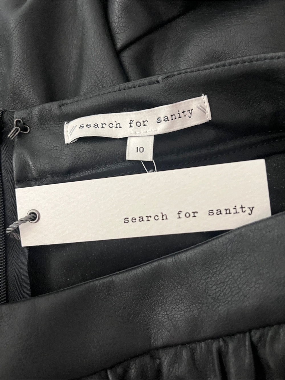 Search for Sanity Black Faux Leather Piece with Tag